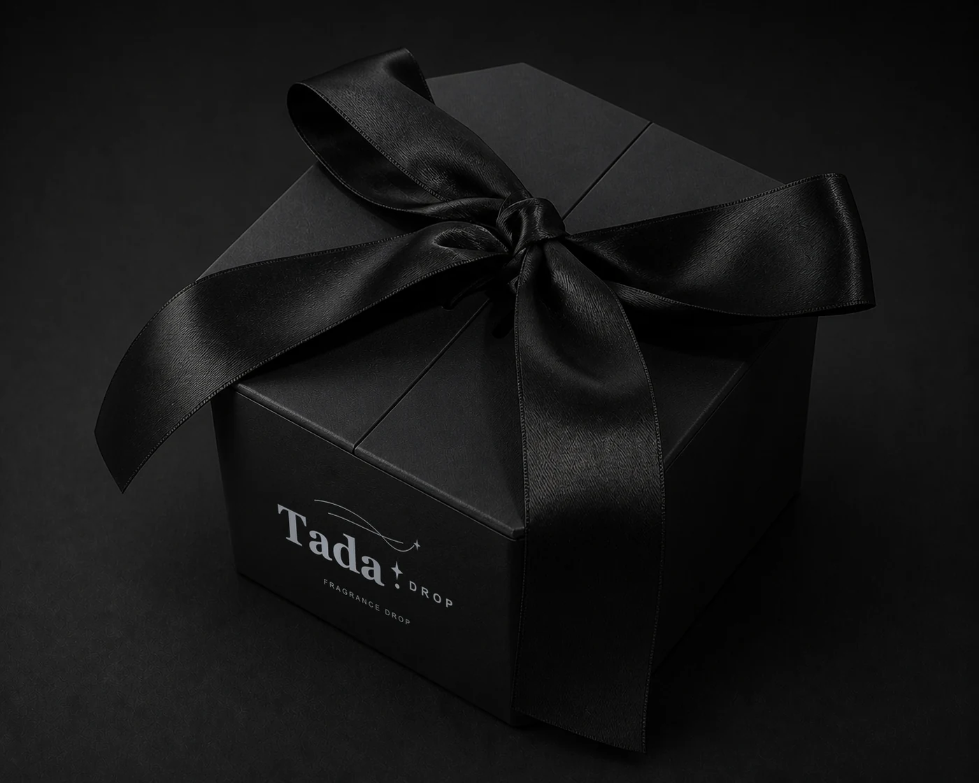 Reserve Fragrance Drop wrapped in black satin ribbon